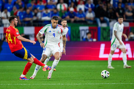 Aymeric Laporte of Spain and Gianluca Scamacca of Italy