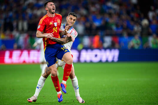 Aymeric Laporte of Spain and Gianluca Scamacca of Italy