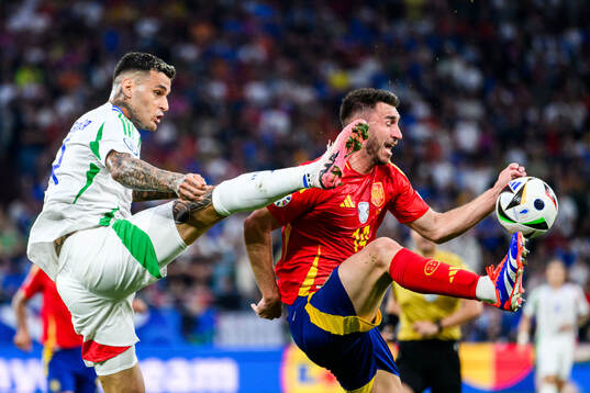 Gianluca Scamacca of Italy and Aymeric Laporte of Spain