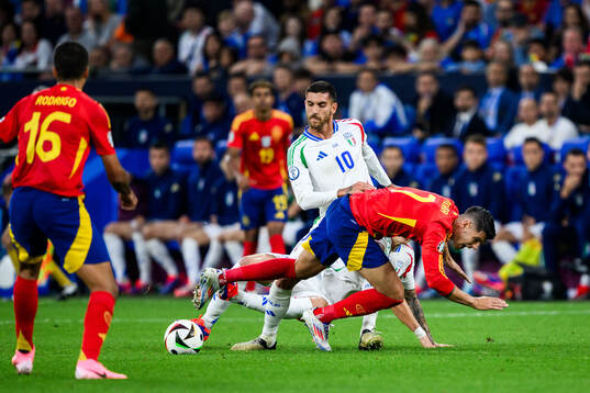 Lorenzo Pellegrini of Italy and Alvaro Morata of Spain