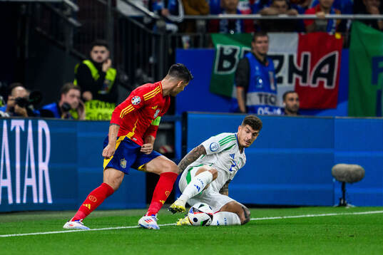 Alvaro Morata of Spain and Giovanni Di Lorenzo of Italy