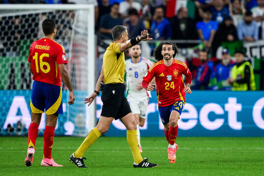 Marc Cucurella of Spain reacts towards Referee Slavko Vincic