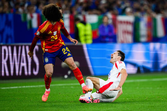 Marc Cucurella of Spain and Federico Chiesa of Italy