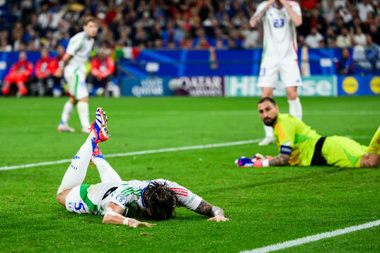 Riccardo Calafiori of Italy looks dejected
