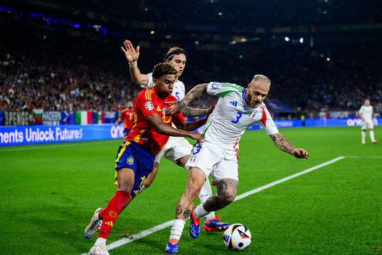 Lamine Yamal of Spain against Riccardo Calafiori and