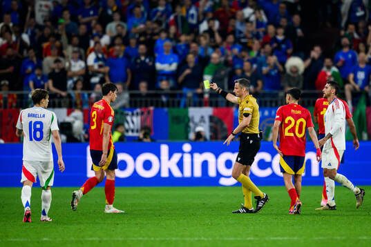 Robin Aime Le Normand Mainfray of Spain receives a yellow