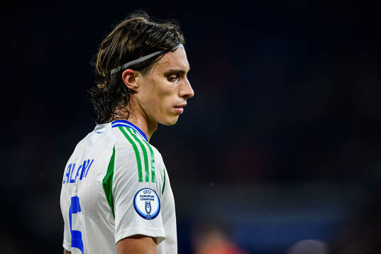 Riccardo Calafiori of Italy looks dejected
