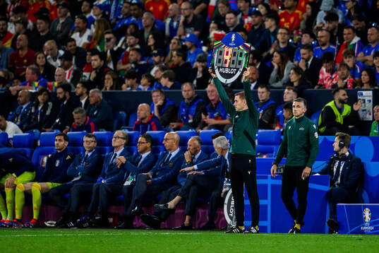 The fourth official Clément Turpin holds up a sign showing