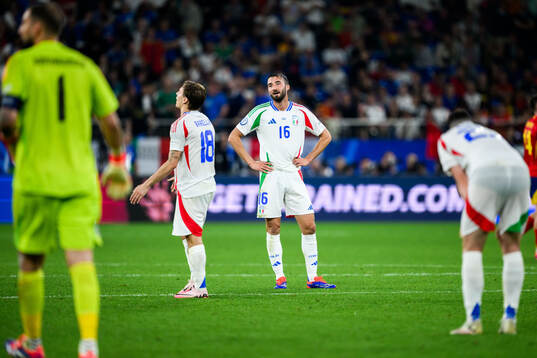 Nicolo Barella and Bryan Cristante of Italy look dejected