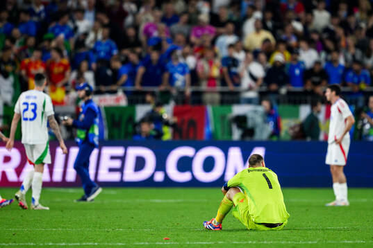 Goalkeeper Gianluigi Donnarumma of Italy looks dejected