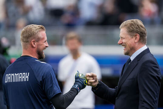 Goalkeeper Kasper Schmeichel of Denmark with father Peter