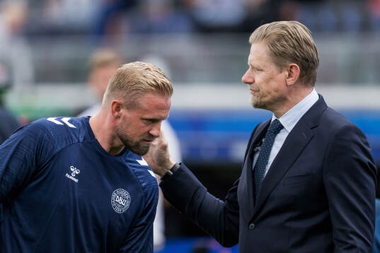 Goalkeeper Kasper Schmeichel of Denmark with father Peter