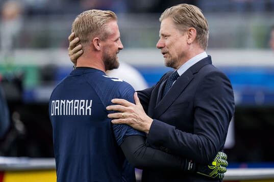 Goalkeeper Kasper Schmeichel of Denmark with father Peter