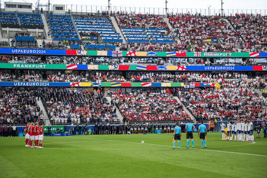 Players of Denmark and of England honouring the memory of