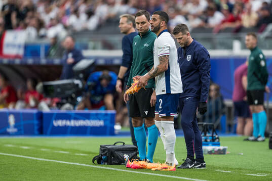 Kyle Walker of England changes shoes