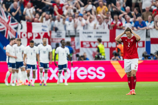 Joachim Christian Andersen of Denmark looks dejected