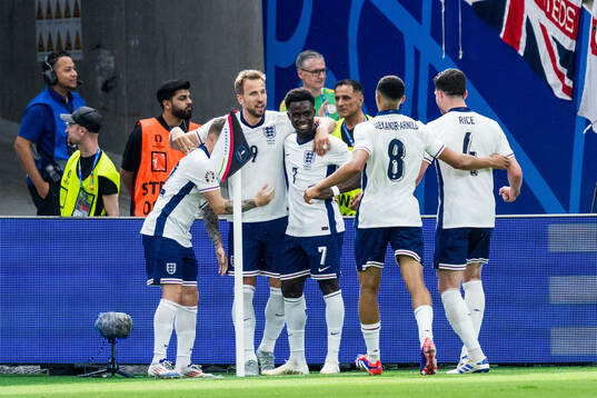 Harry Kane of England celebrates with Bukayo Saka