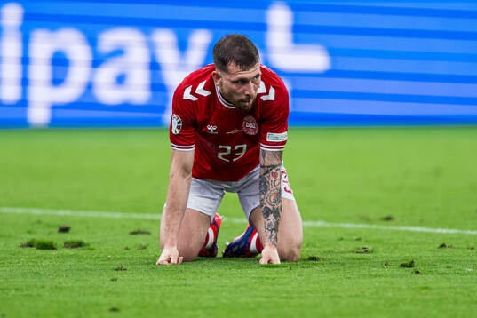 Pierre-Emil Højberg of Denmark looks dejected