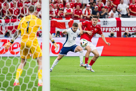 Kieran Trippier of England and Joakim Mæhle of Denmark