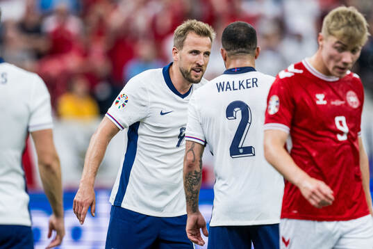 Harry Kane of England reacts against Kyle Walker