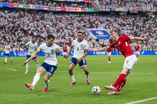 John Stones of England and Rasmus Højlund of Denmark