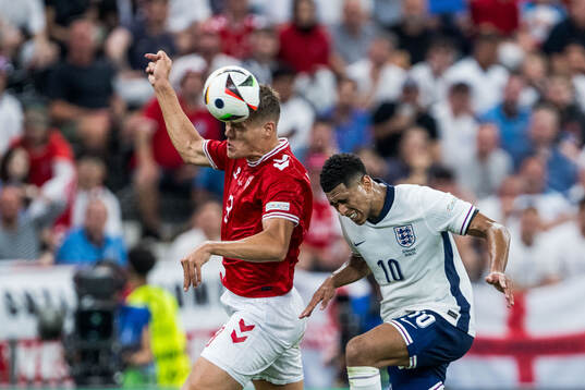 Jannik Vestergaard of Denmark and Jude Bellingham of England
