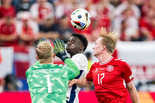 Goalkeeper Kasper Schmeichel and Victor Kristiansen of
