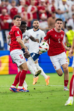 Andreas Kristiansen and Joakim Mæhle of Denmark and Bukayo