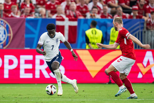 Bukayo Saka of England and Christian Eriksen of Denmark