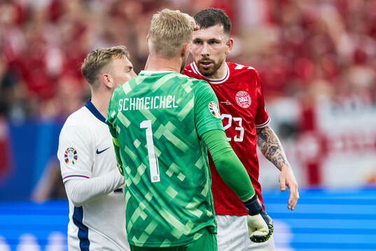 Pierre-Emil Højberg of Denmark celebrates with goalkeeper
