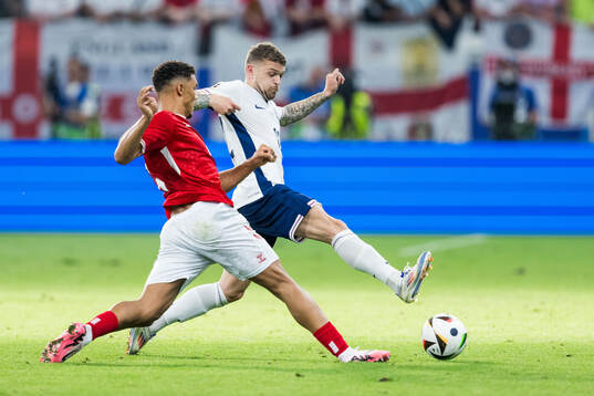 Alexander Bah of Denmark and Kieran Trippier of England