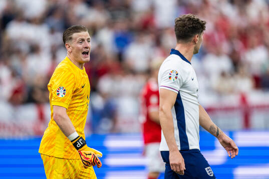 Goalkeeper Jordan Pickford and John Stones of England