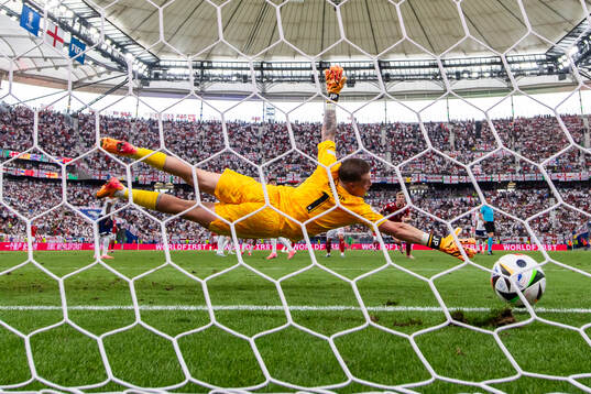 Morten Hjulmand of Denmark scores 1-1 behind goalkeeper