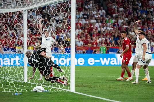 Goalkeeper Predrag Rajkovic of Serbia and Jonas Wind of