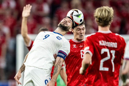 Aleksandar Mitrovic of Serbia and Andreas Kristiansen of