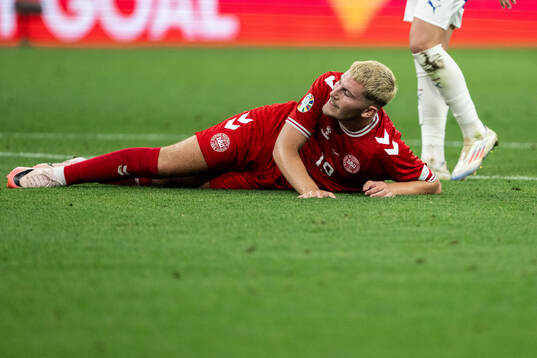 Jonas Wind of Denmark looks dejected