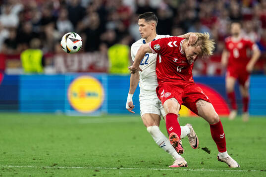 Sasa Lukic of Serbia and Kasper Dolberg of Denmark