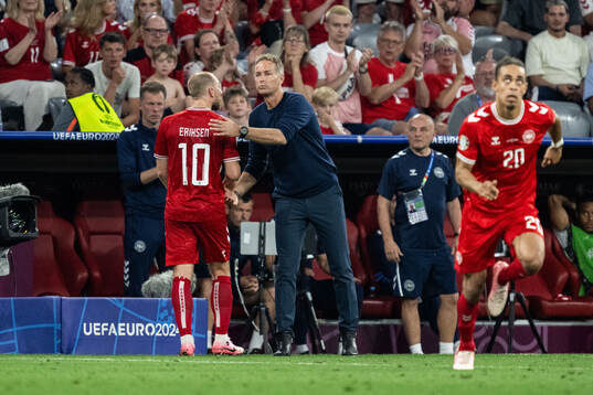 Christian Eriksen and head coach Kasper Hjulmand of Denmark
