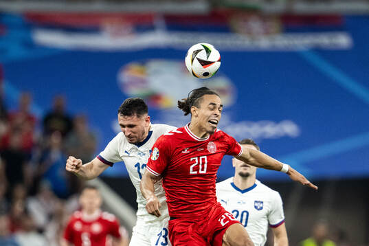 Milos Veljkovic of Serbia and Yussuf Poulsen of Denmark