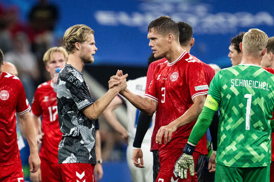 Morten Hjulmand and Jannik Vestergaard of Denmark celebrate