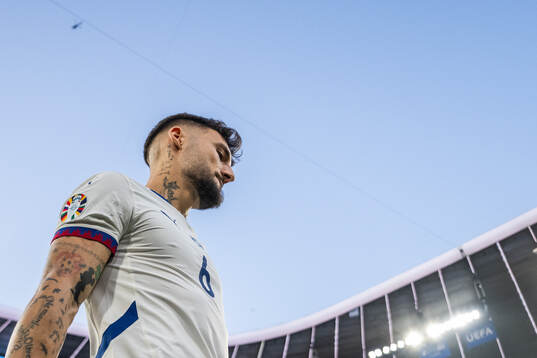 Nemanja Gudelj of Serbia enters the pitch
