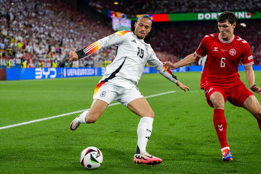 Leroy Sane of Germany and Andreas Christensen of Denmark