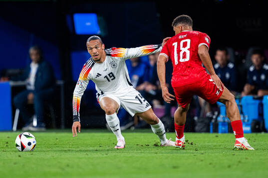 Leroy Sane of Germany and Alexander Bah of Denmark