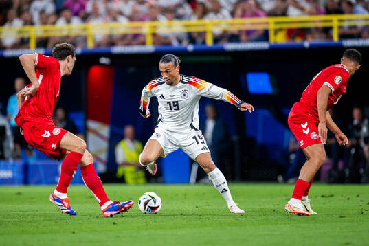 Leroy Sane of Germany and Andreas Christensen and Alexander