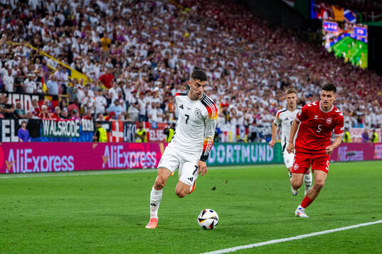 Kai Havertz of Germany and Joakim Mæhle of Denmark