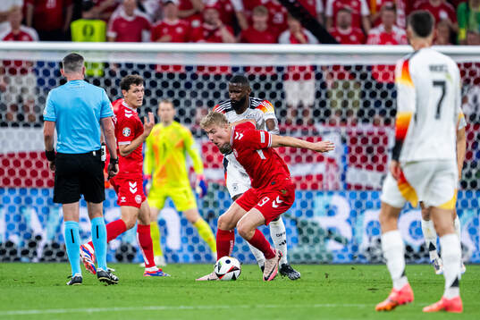 Rasmus Højlund of Denmark and Antonio Ruediger of Germany