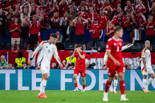 Joakim Mæhle of Denmark looks dejected