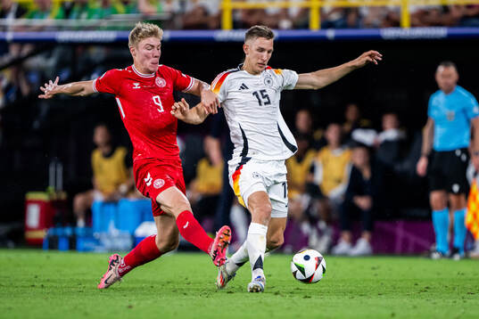Rasmus Højlund of Denmark and Nico Schlotterbeck of Germany