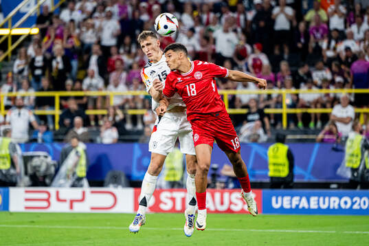 Nico Schlotterbeck of Germany and Alexander Bah of Denmark