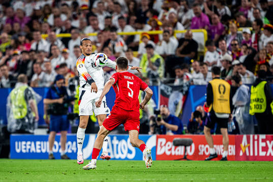 Leroy Sane of Germany and Joakim Mæhle of Denmark